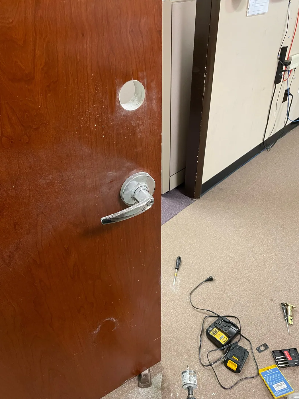 Commercial office door prepped for a new lever lock